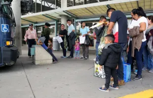 April 17, 2019: Central American migrants seeking asylum line up at the bus station in McAllen, Texas to go stay with their sponsors Vic Hinterlang/Shutterstock
